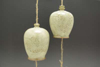 These wind chimes were hand-thrown and hand-carved with hummingbirds.  Two different poses, as shown in the picture, are found in each of these wind chime.  Each wind chime is already assembled with natural jute string (and along with it, fishing line to add strength), ceramic striker (to make sound) and wooden windcatcher (on which wishes and blessings can be written with Sharpie pen).  They can be hung outdoor on a porch or under an overhang.